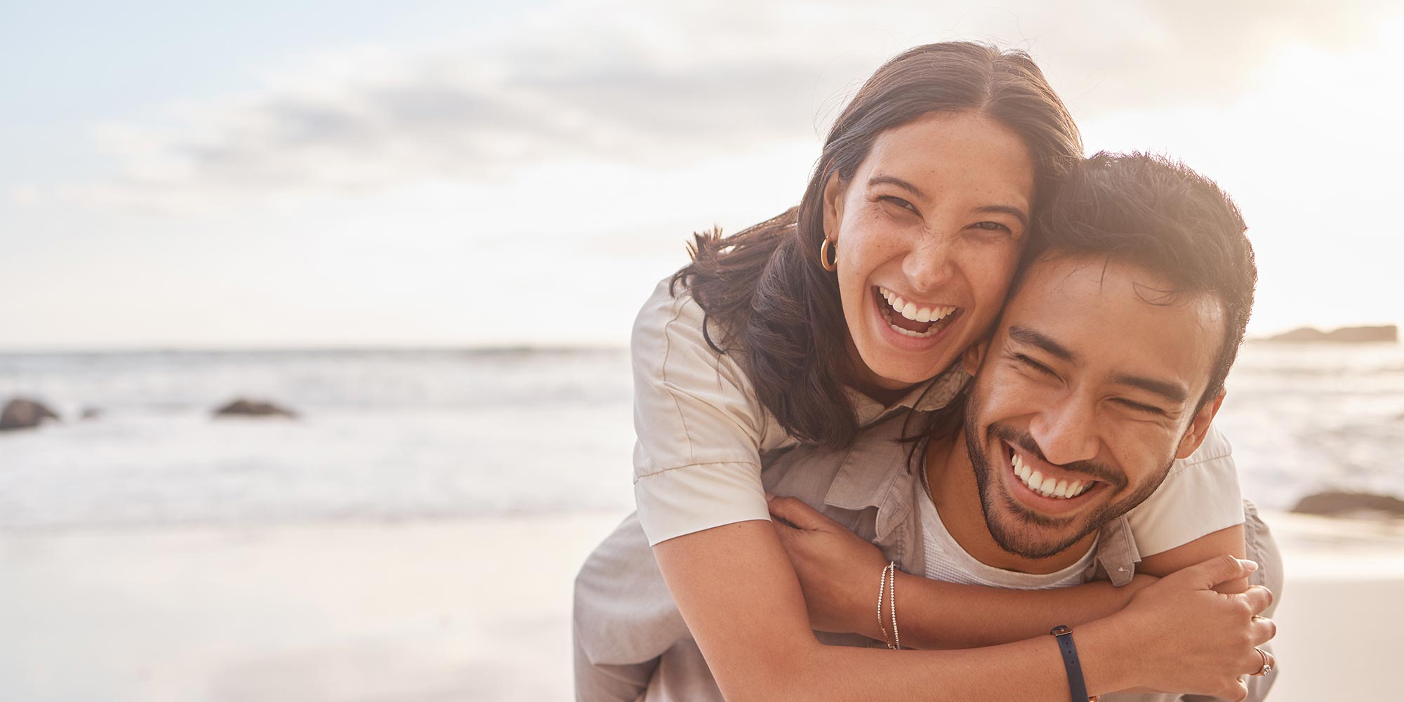 couple on the beach playing