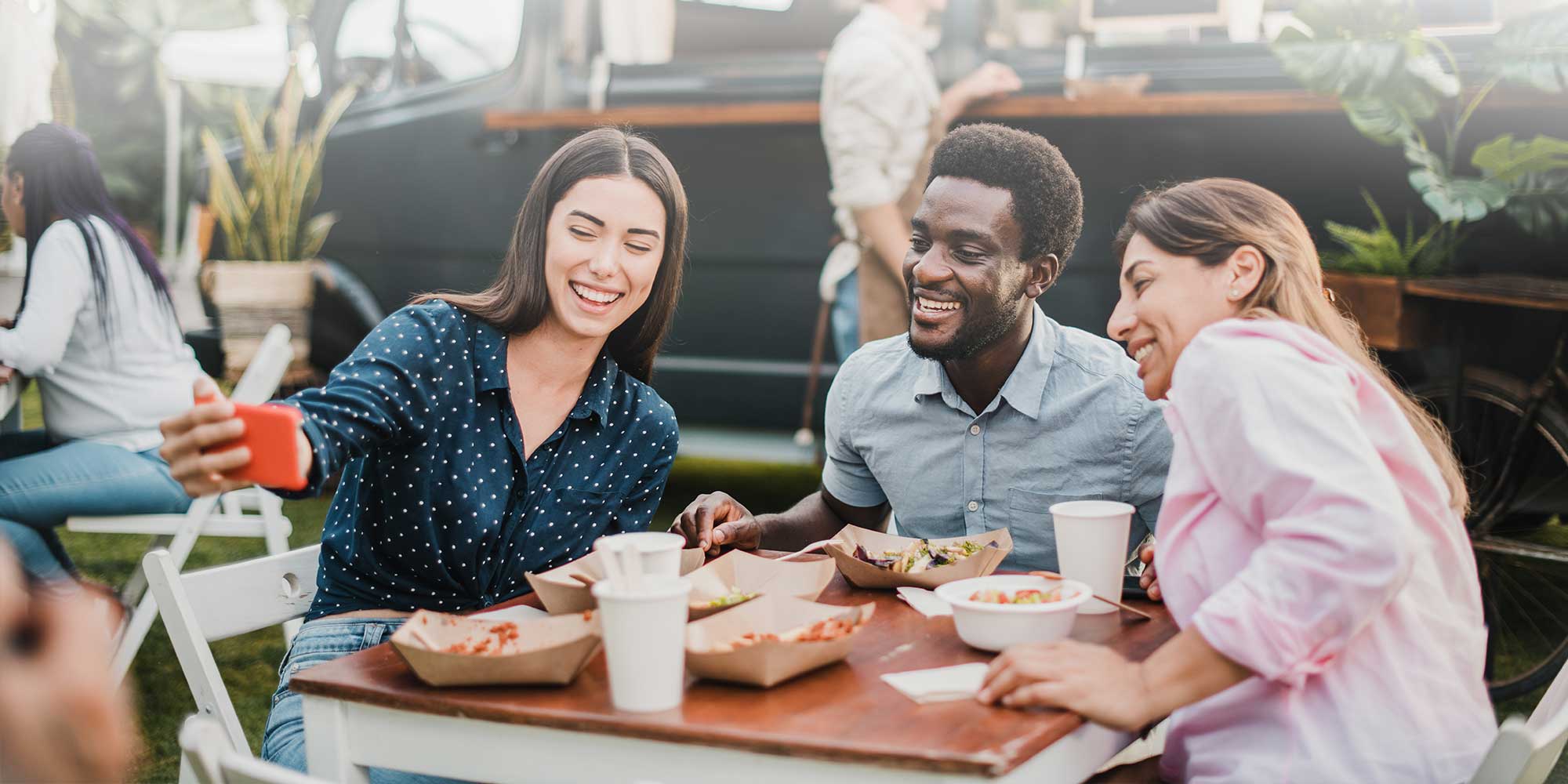 Group of people taking a selfie over food