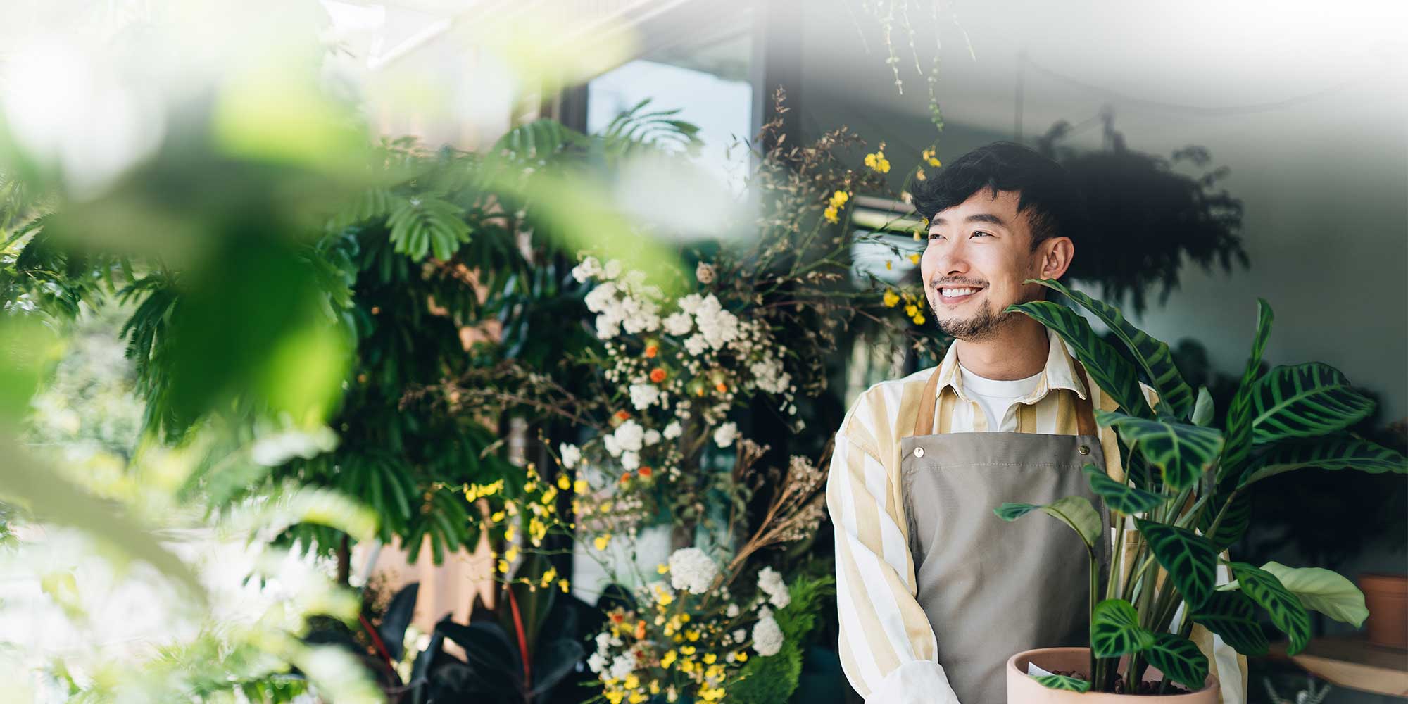 Man smiling in a plant store