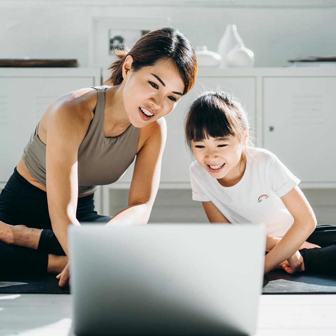 mom and daughter on laptop