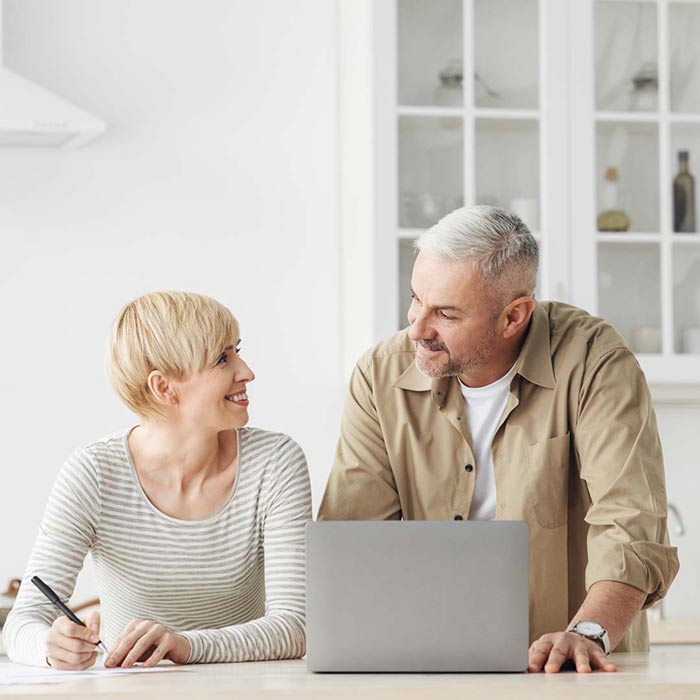 Older couple looking at laptop