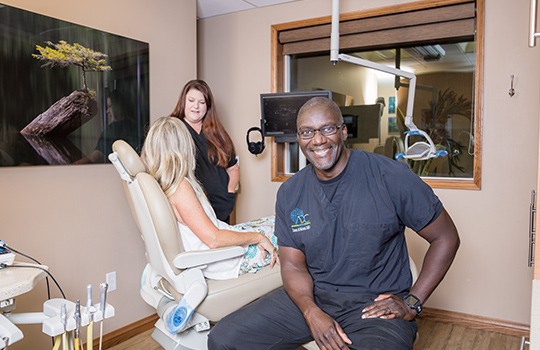 dana sitting in the room with a patient